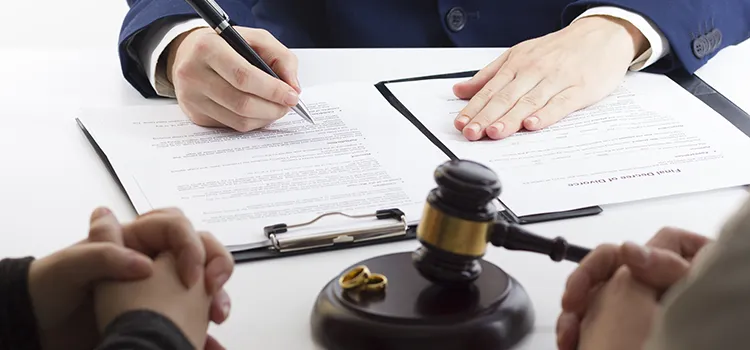 A lawyer reviewing a divorce document for a married couple.