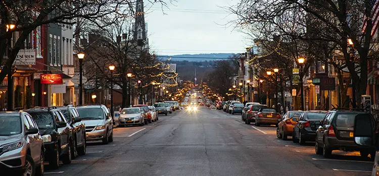 A photo looking down Warren St in Hudson, NY during the evening. 