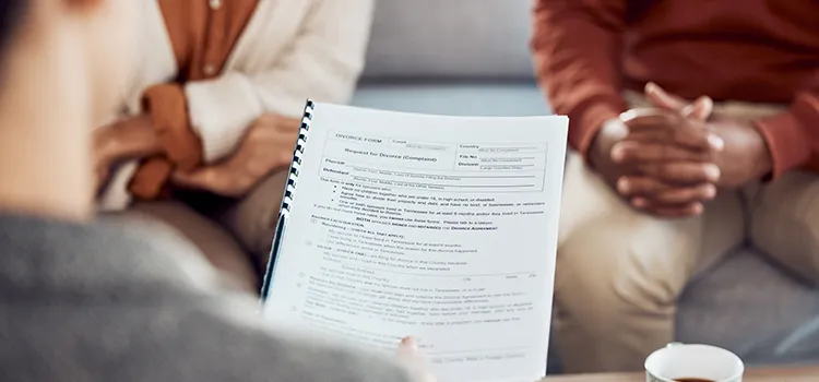 A couple receiving a consultation about divorce documents.
